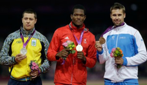 T&T's Keshorn Walcott is flanked by Ukraine's Oleksandr Pyatnytsya, left, and Finland's Antti Ruuskanen during the awards ceremony for the men's javelin during the athletics in the Olympic Stadium at the 2012 Summer Olympics, London, on Saturday. AP Photo